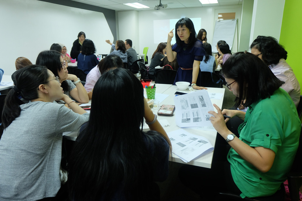 Participants blending essential oils at a Zenergy workshop